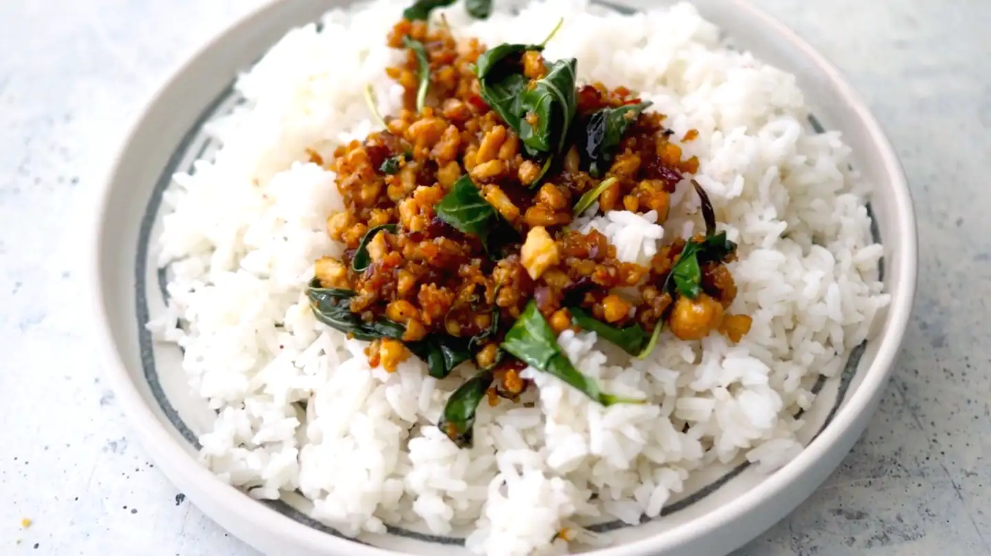 Thai basil tofu bowl with fresh herbs, a flavorful vegetarian dish filled with Thai spices and Ayurvedic ingredients.